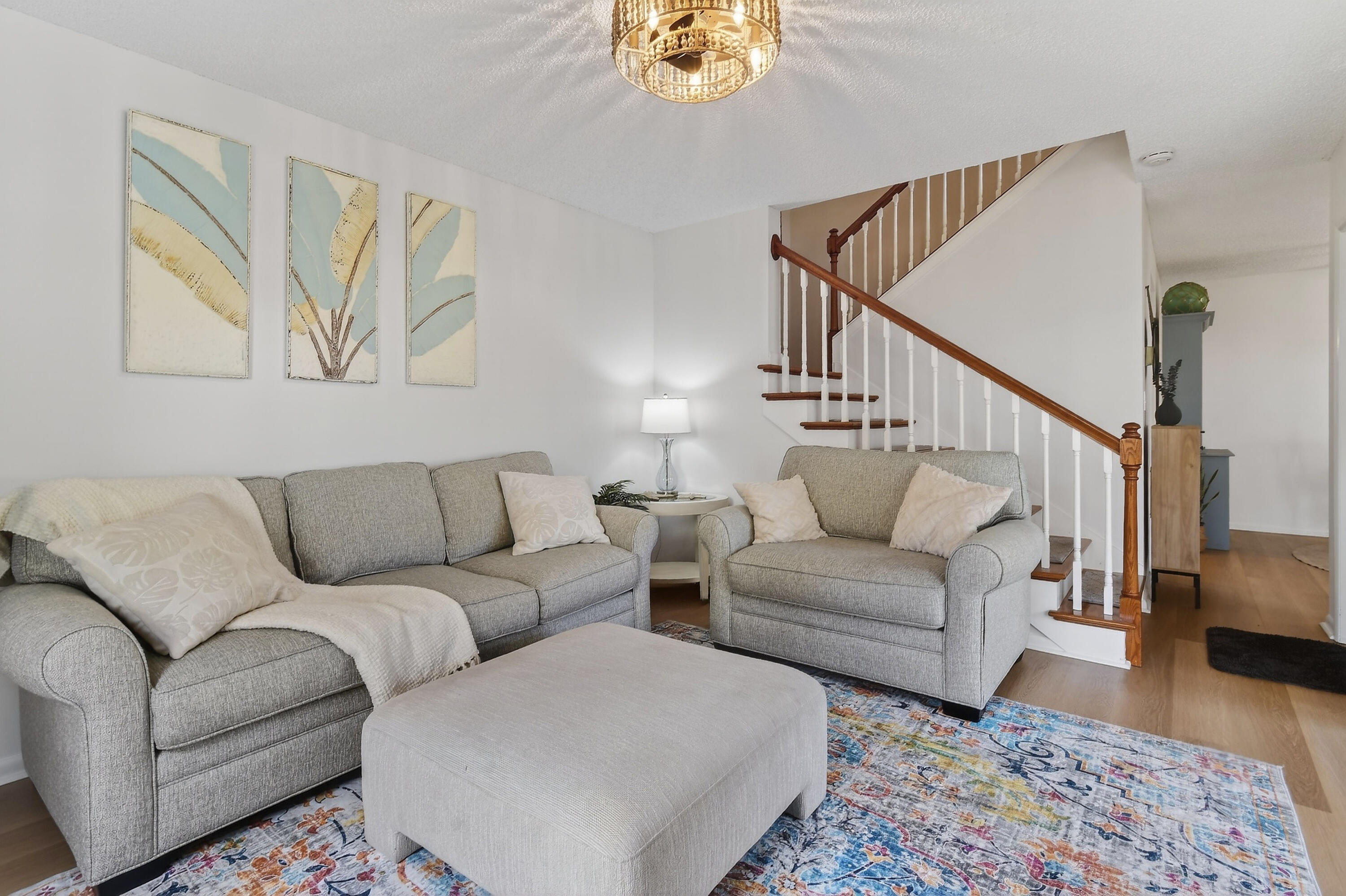 717 Highway 1, Unit 912 Jupiter, FL 33477 - Photo 3 of 45 a living room with furniture and a wooden floor