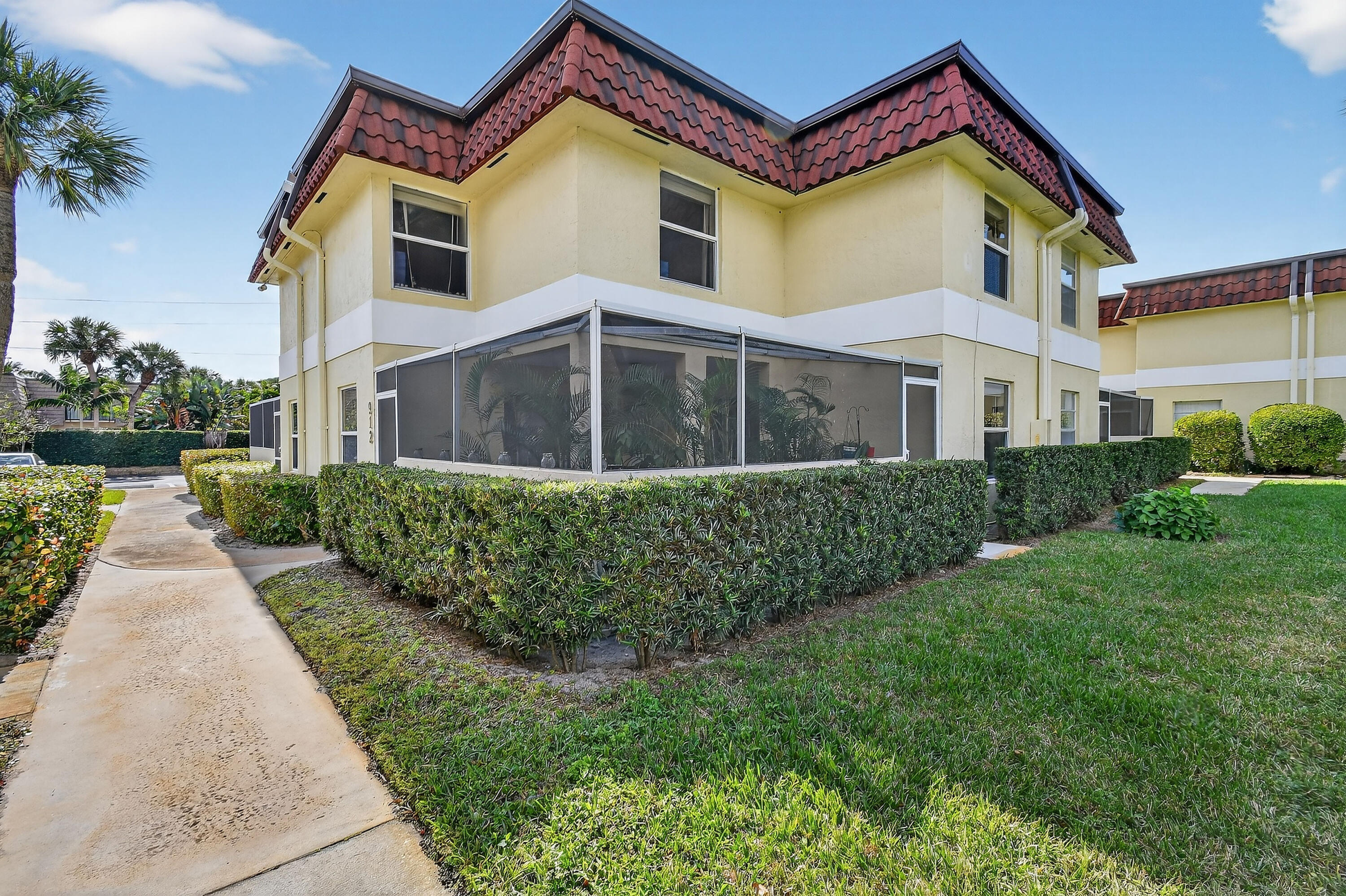 717 Highway 1, Unit 912 Jupiter, FL 33477 - Photo 33 of 45 a front view of a house with a yard