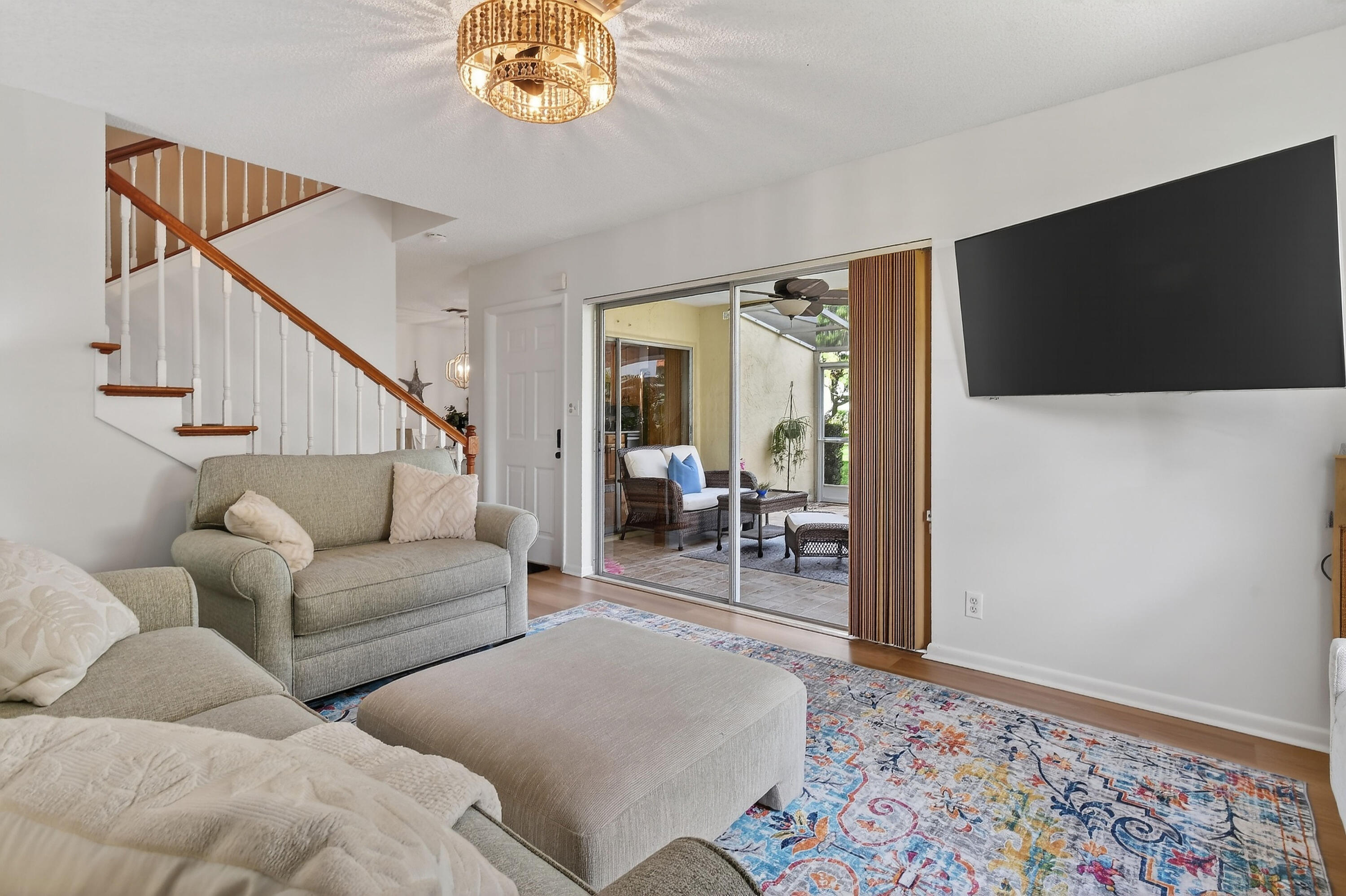 717 Highway 1, Unit 912 Jupiter, FL 33477 - Photo 6 of 45 a living room with furniture and a flat screen tv