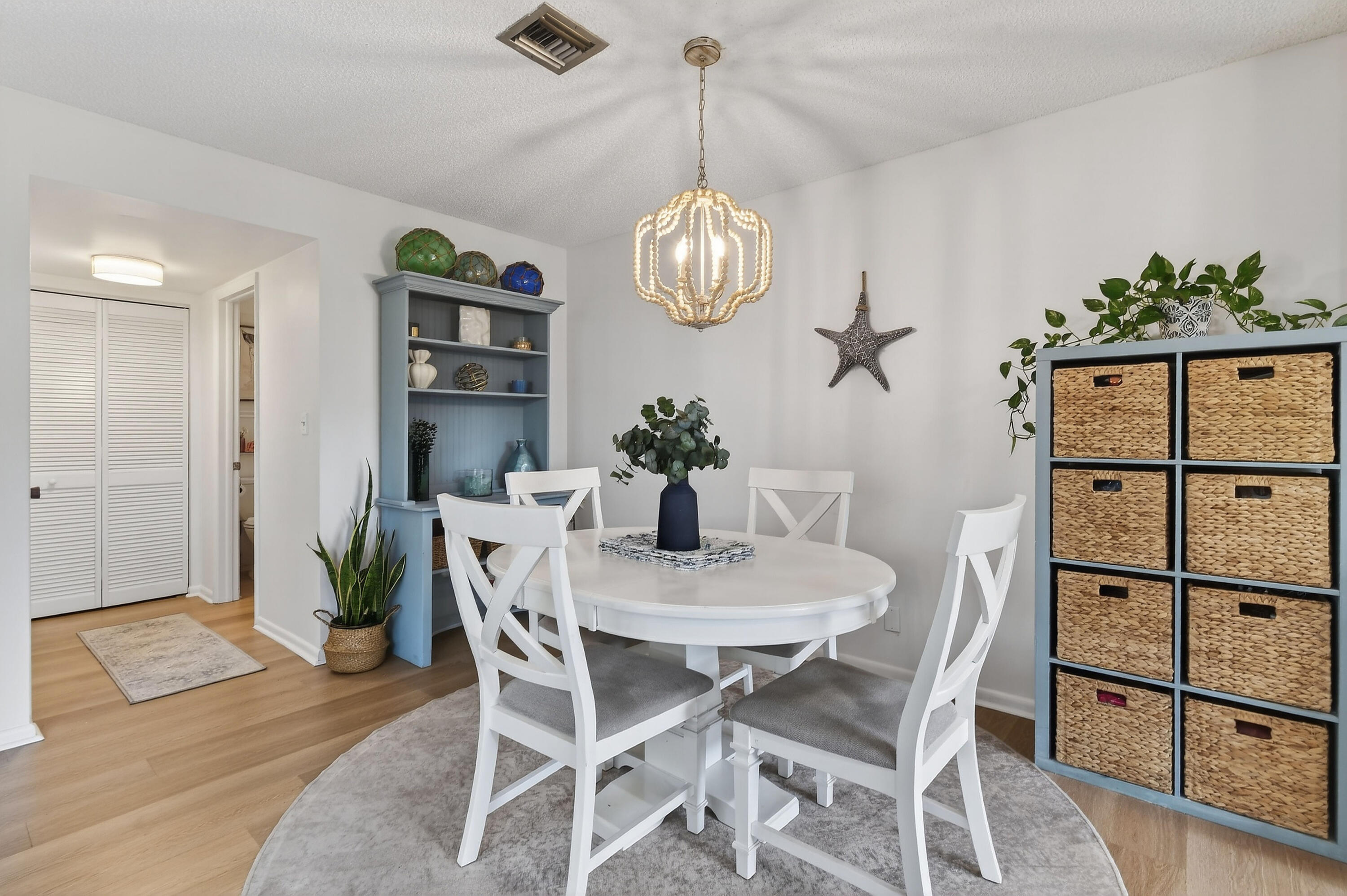 717 Highway 1, Unit 912 Jupiter, FL 33477 - Photo 8 of 45 a view of a dining room with furniture and chandelier