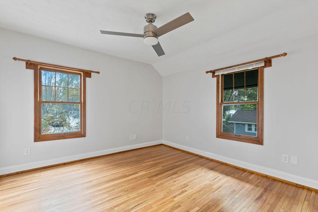 222 Brighton Road Columbus, OH 43202 - Photo 29 of 46 • Re-finished hardwood flooring 2023 • Lighted ceiling fan •White painted walls •Closet