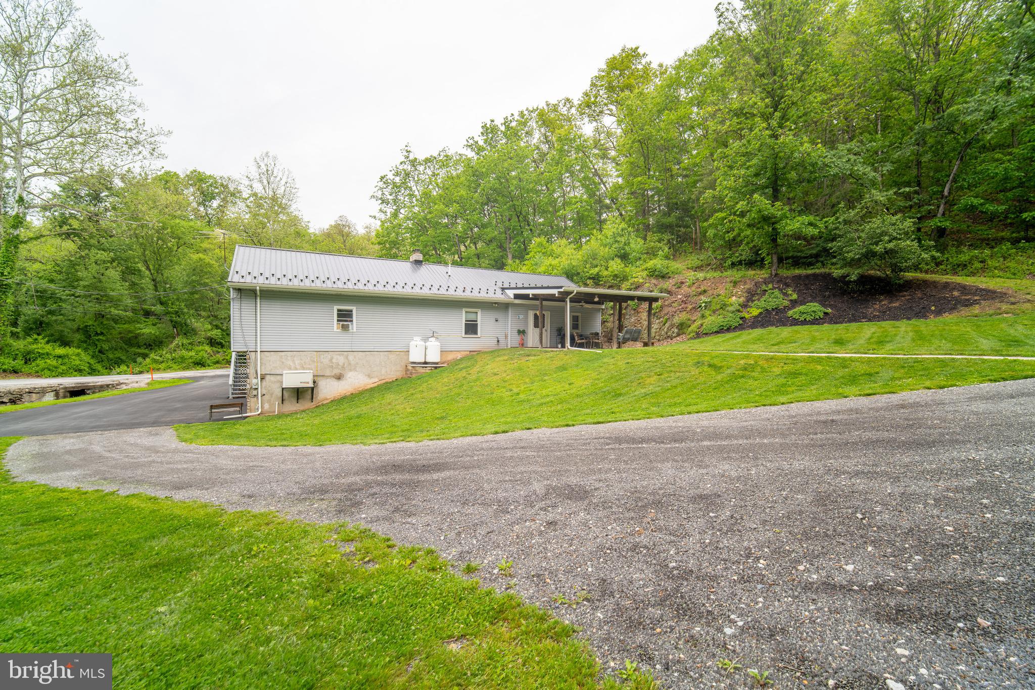 13127 Manor Furnace Road Brogue, PA 17309 - Photo 15 of 78 a view of a house with a backyard and a tree