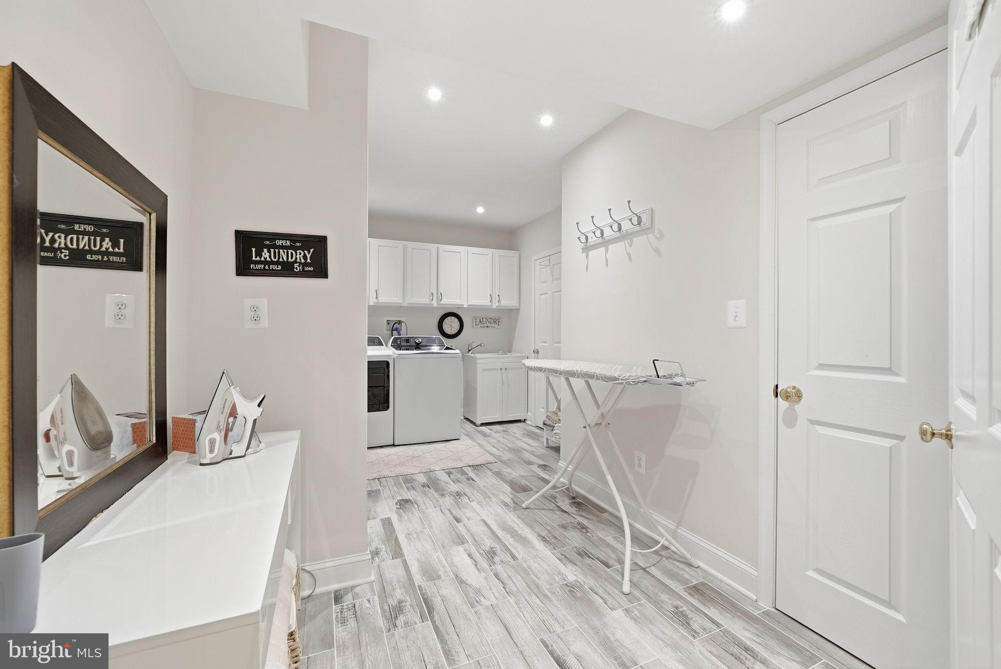 12309 Blair Ridge Road Fairfax, VA 22033 - Photo 68 of 80 LAUNDRY ROOM WITH PLENTY OF HANGING SPACE & SINK