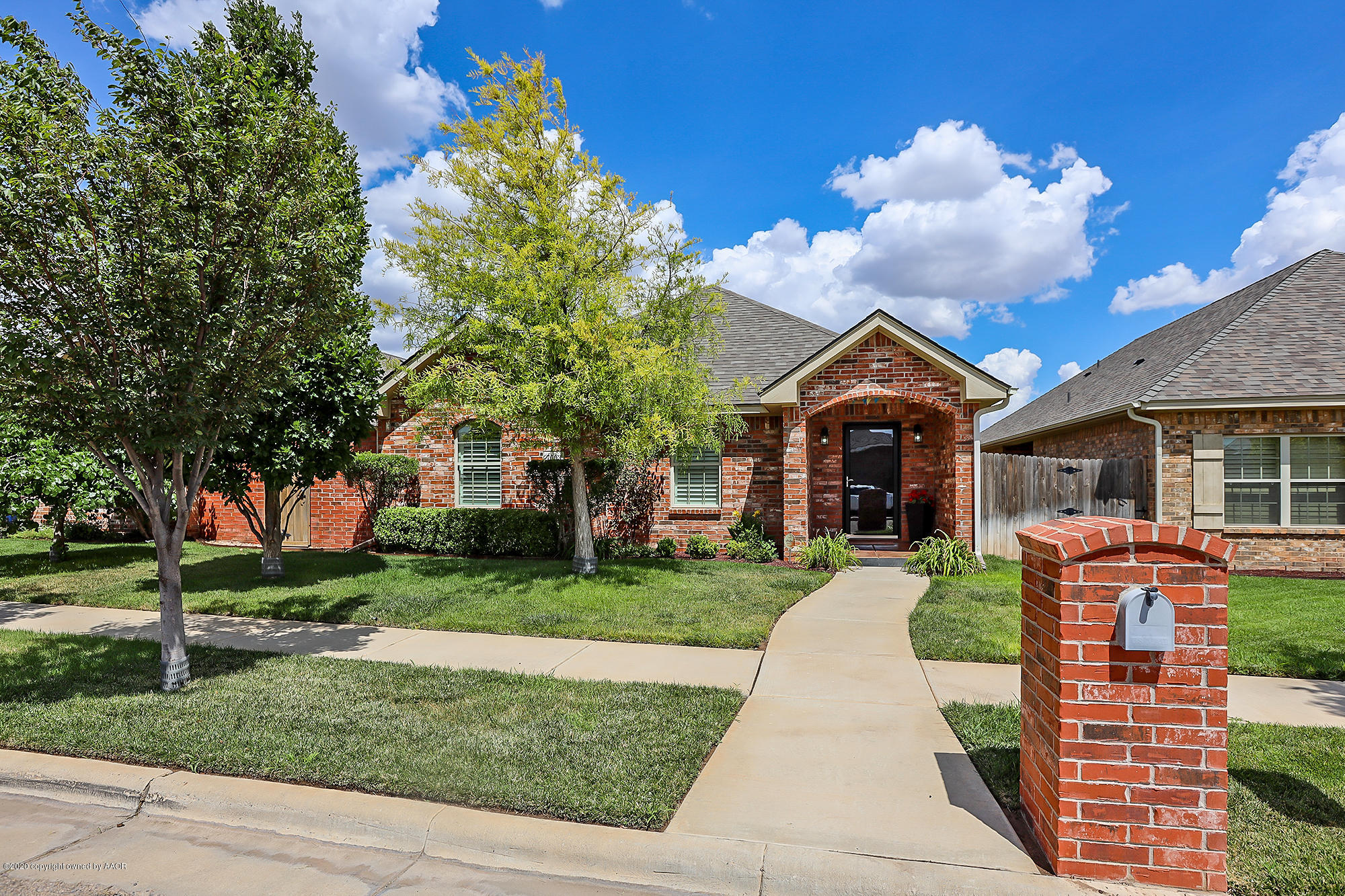 7003 Nick Street Amarillo, TX 79119 - Photo 1 of 34 a front view of a house with a yard and garage