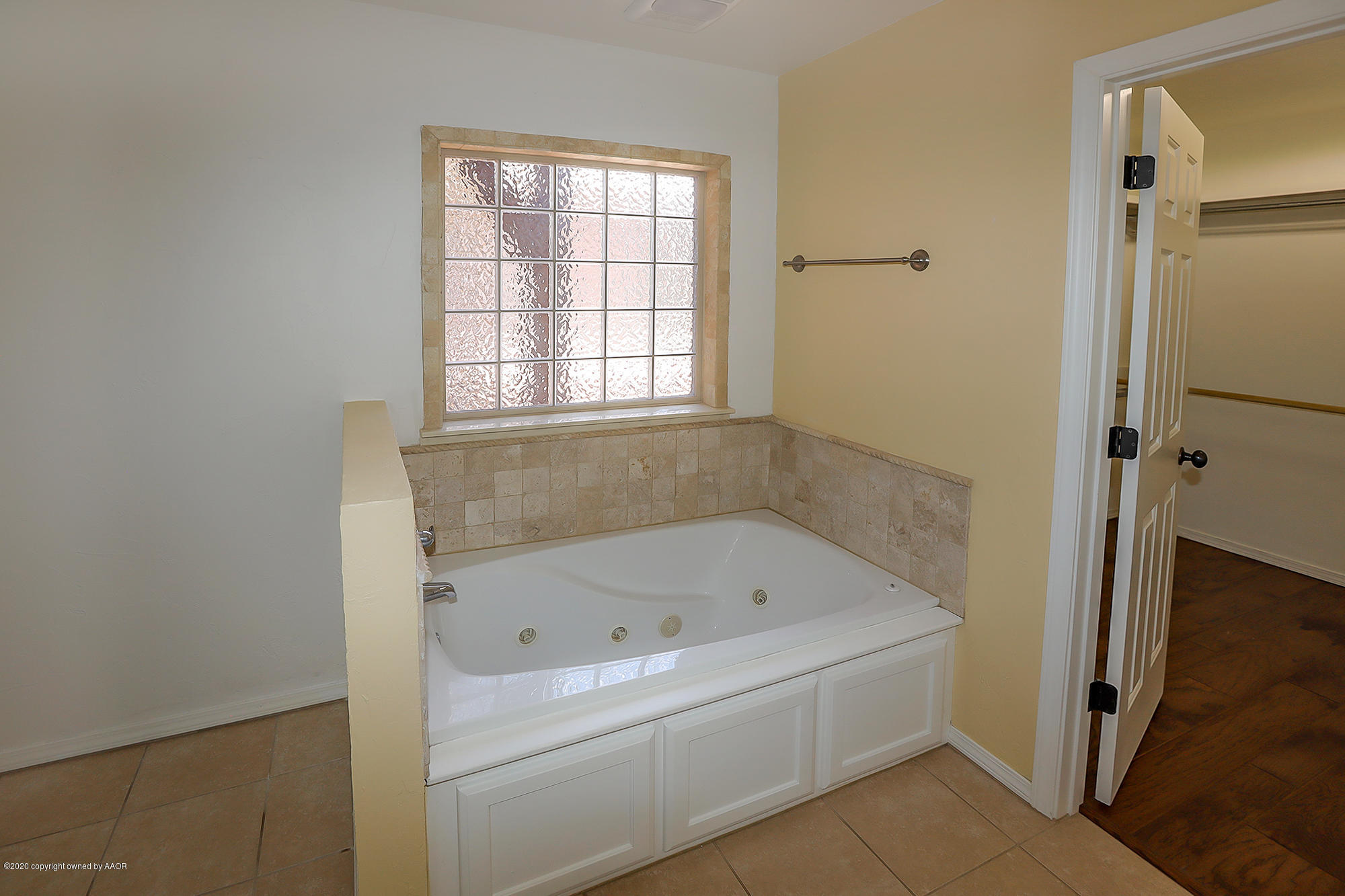7003 Nick Street Amarillo, TX 79119 - Photo 14 of 34 a white bath tub sitting next to a window