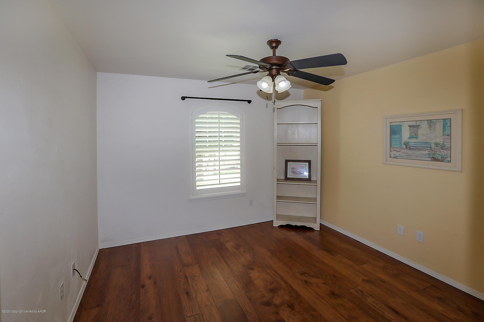 7003 Nick Street Amarillo, TX 79119 - Photo 20 of 34 a view of empty room with wooden floor and fan