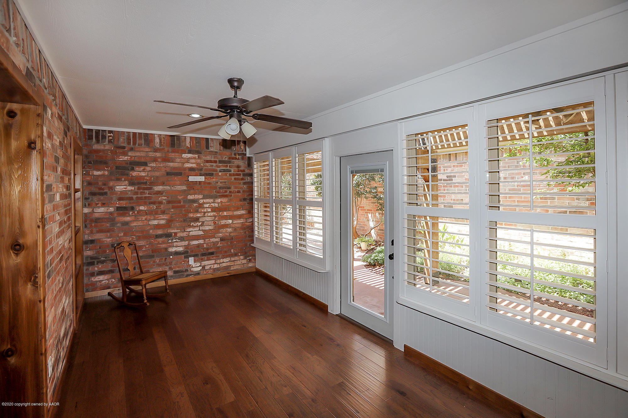 7003 Nick Street Amarillo, TX 79119 - Photo 22 of 34 a view of empty room with wooden floor and fan