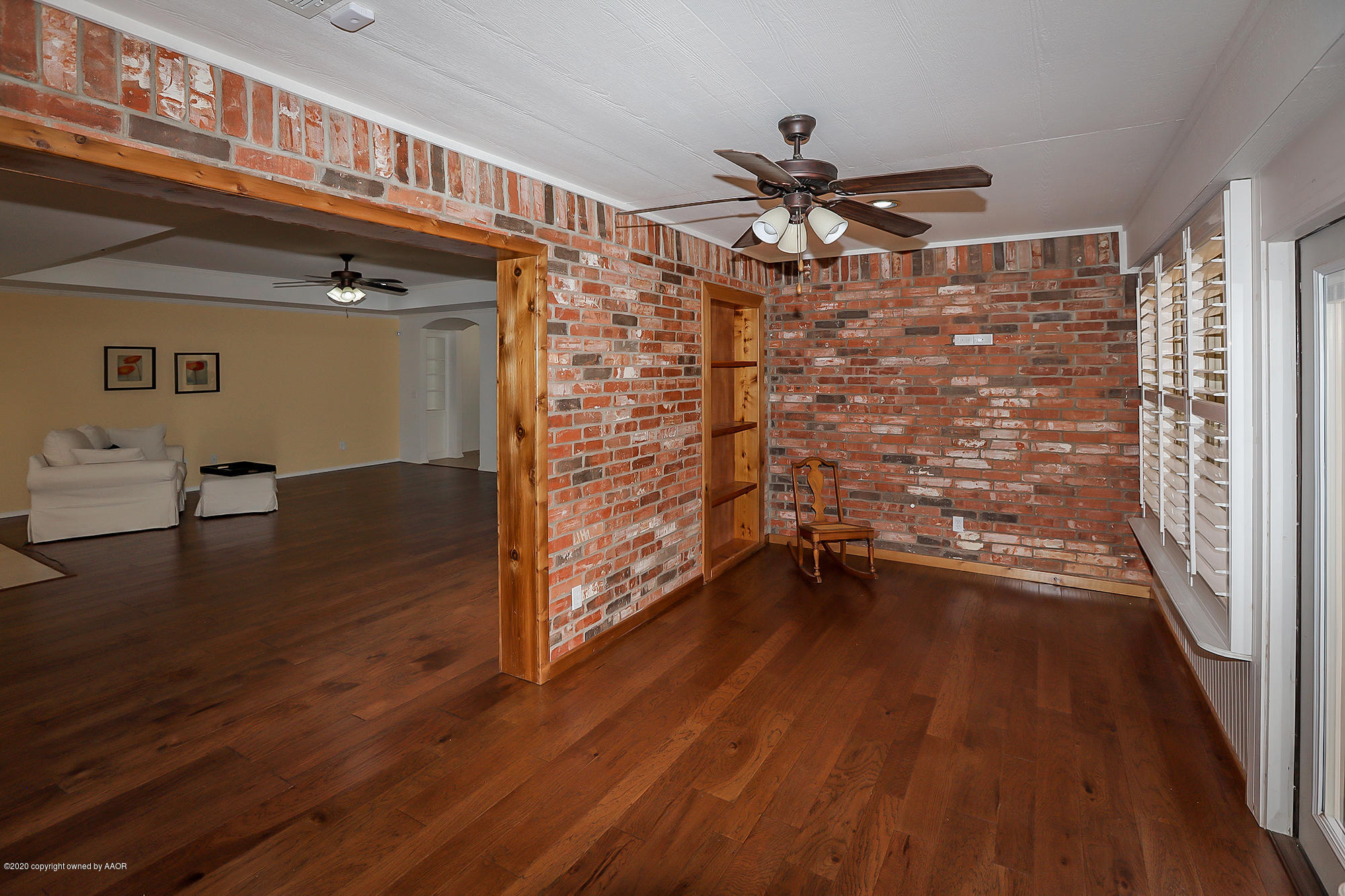 7003 Nick Street Amarillo, TX 79119 - Photo 23 of 34 a view of empty room with wooden floor and fan