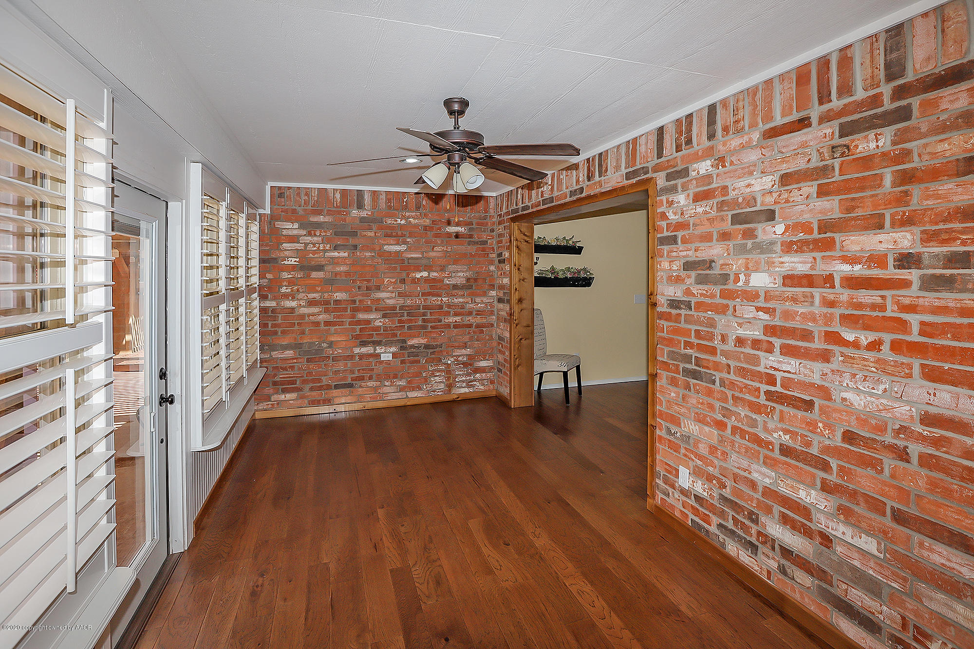 7003 Nick Street Amarillo, TX 79119 - Photo 24 of 34 a view of empty room with wooden floor and fan