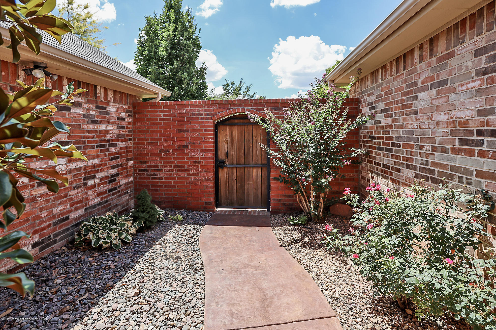 7003 Nick Street Amarillo, TX 79119 - Photo 25 of 34 a front view of a house with a yard