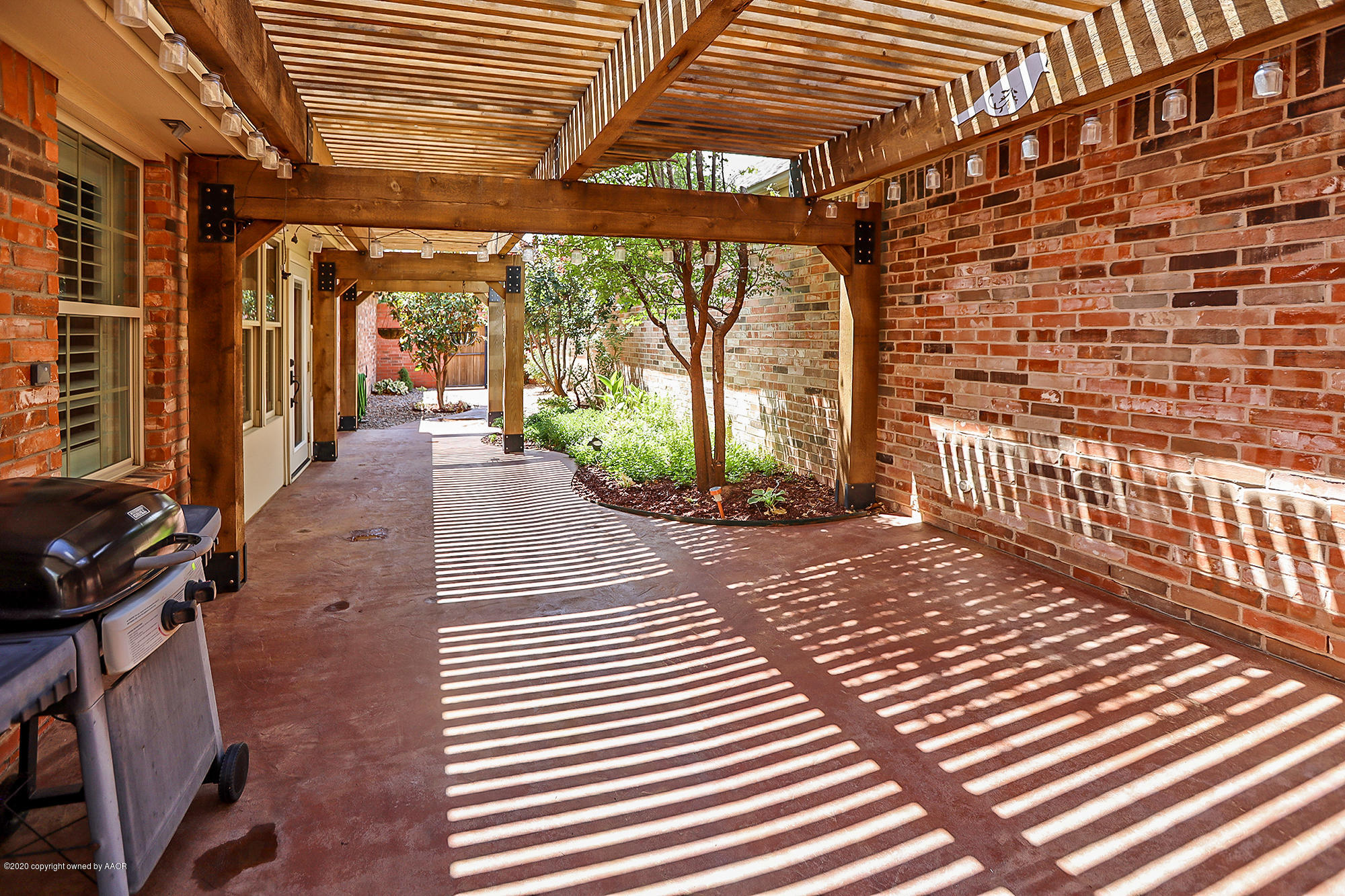 7003 Nick Street Amarillo, TX 79119 - Photo 27 of 34 a view of a porch with wooden floor