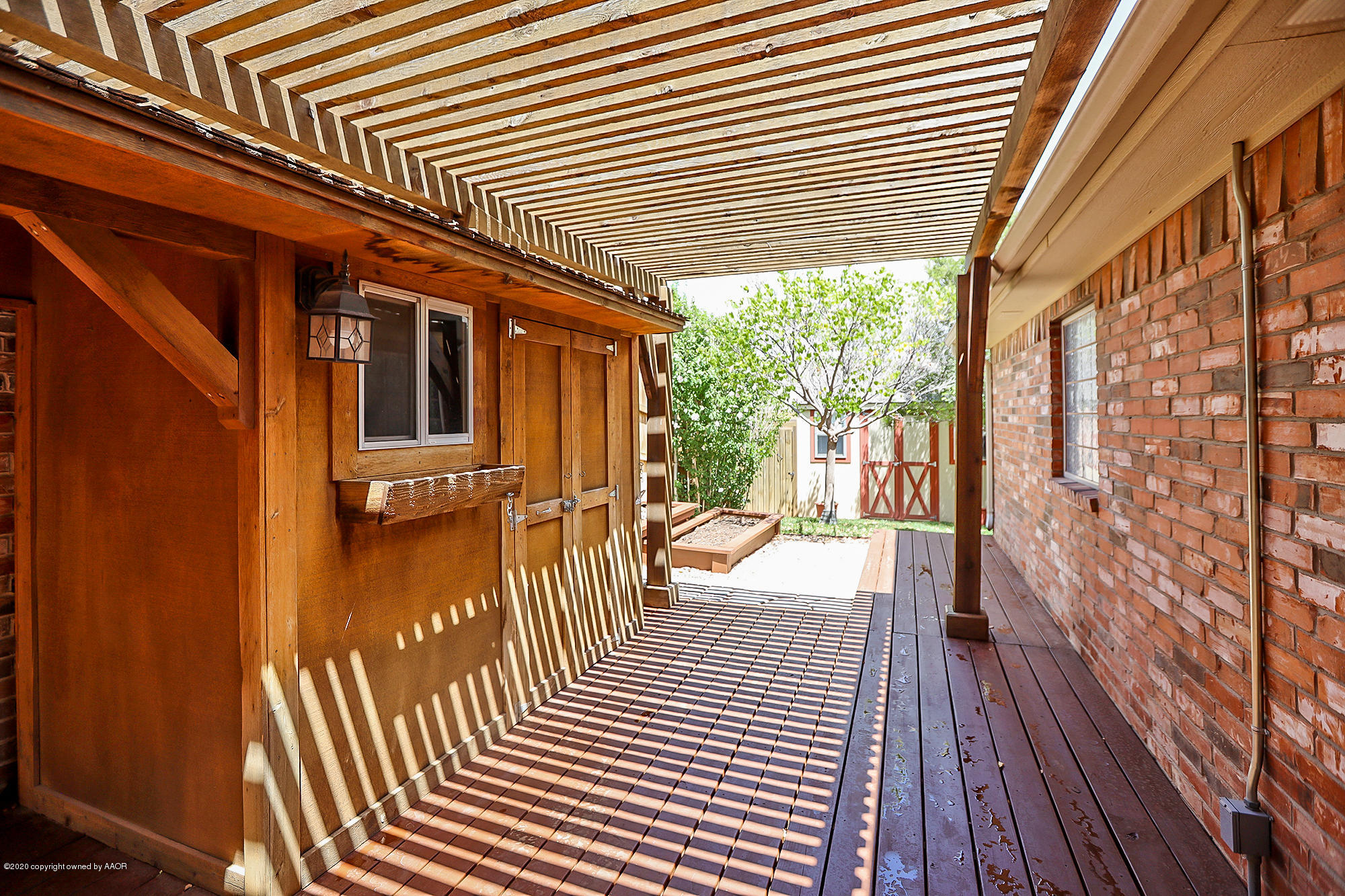 7003 Nick Street Amarillo, TX 79119 - Photo 29 of 34 a porch with wooden floor
