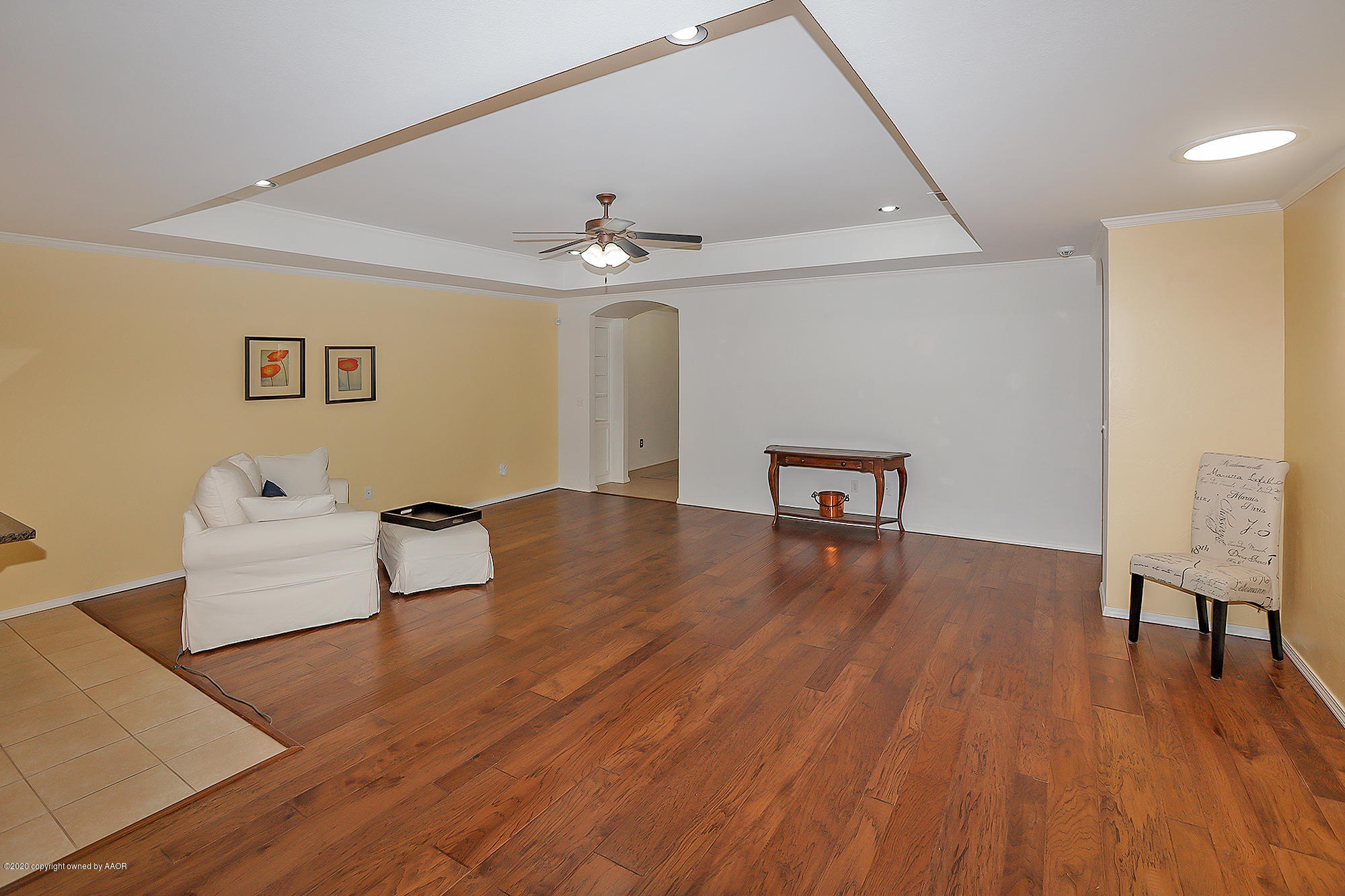 7003 Nick Street Amarillo, TX 79119 - Photo 7 of 34 a living room with furniture and a wooden floor