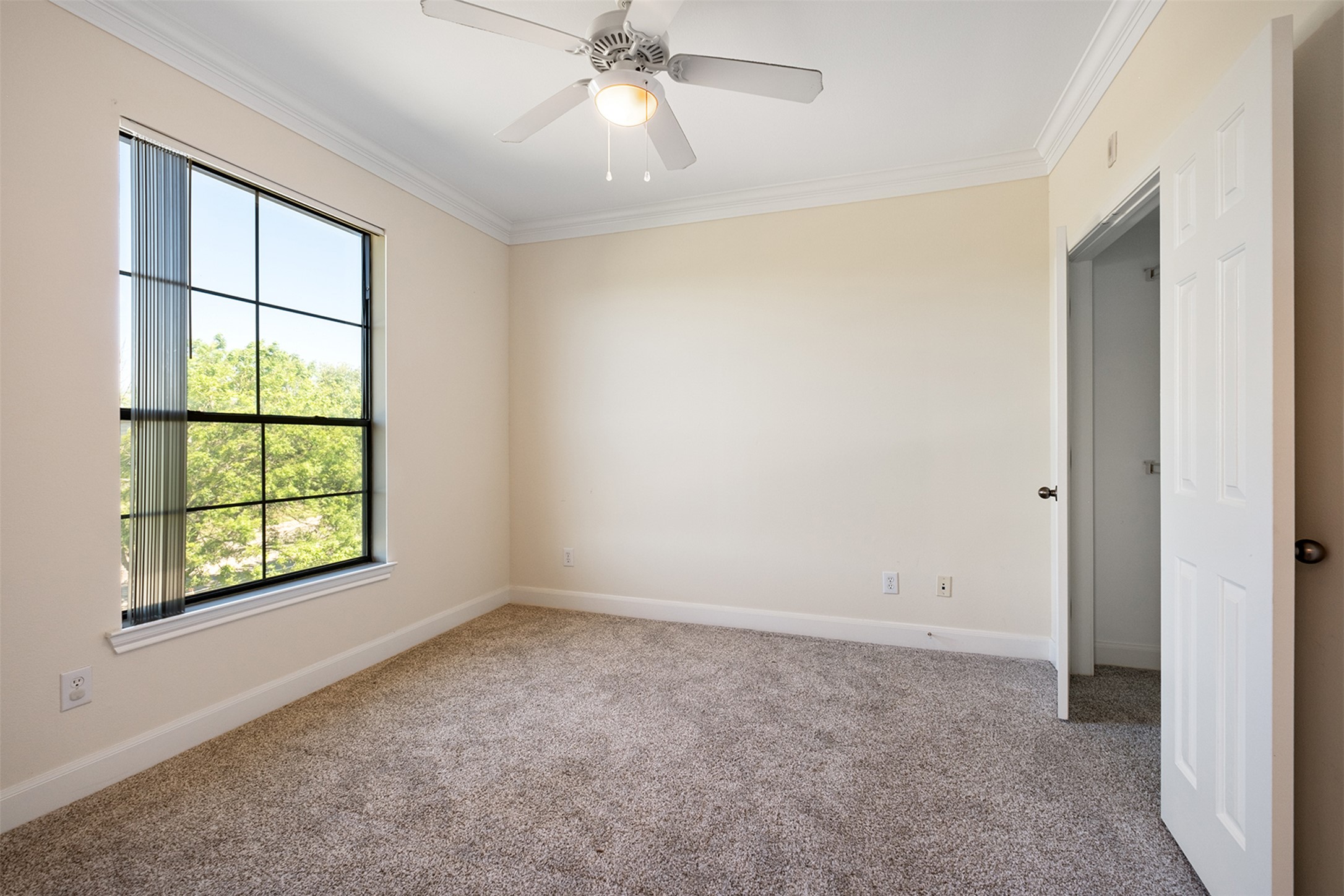 7701 Rialto Boulevard, Unit 637 Austin, TX 78735 - Photo 14 of 25 A quiet bedroom offers comfort and a tranquil view of nature.