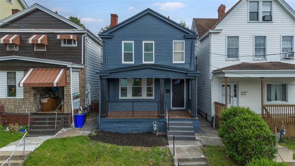 a front view of a house with garden