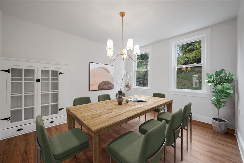 230 Linnview Avenue Pittsburgh, PA 15210 - Photo 11 of 32 a view of a dining room with furniture and window