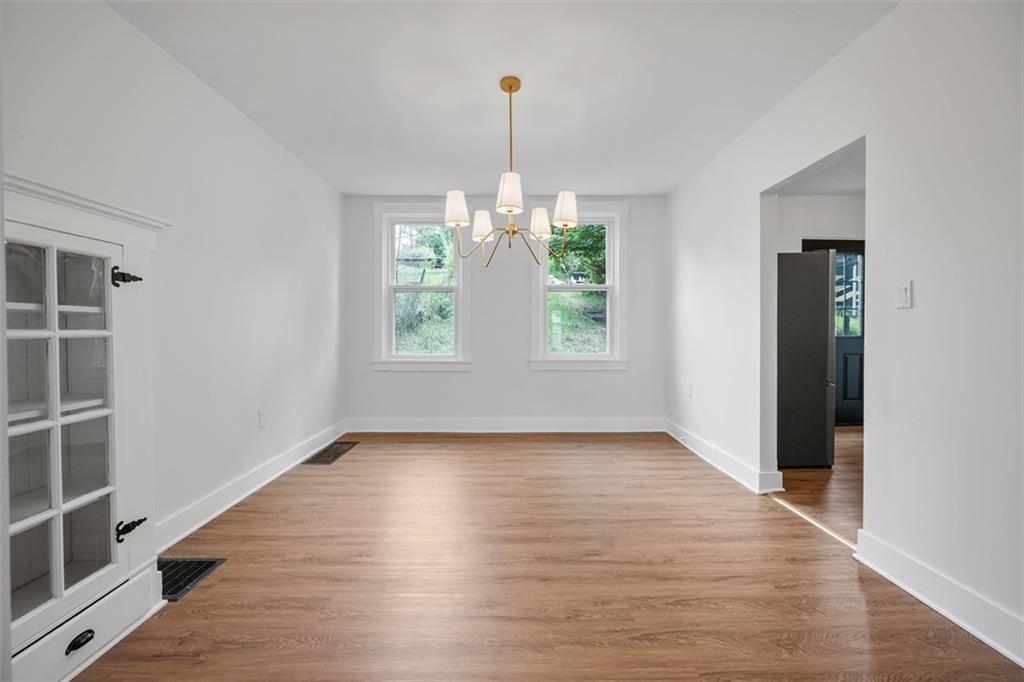 230 Linnview Avenue Pittsburgh, PA 15210 - Photo 13 of 32 wooden floor in an empty room with a window