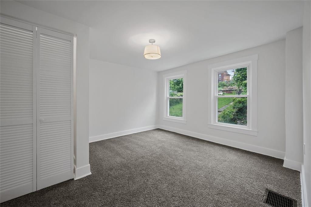 230 Linnview Avenue Pittsburgh, PA 15210 - Photo 18 of 32 an empty room with windows