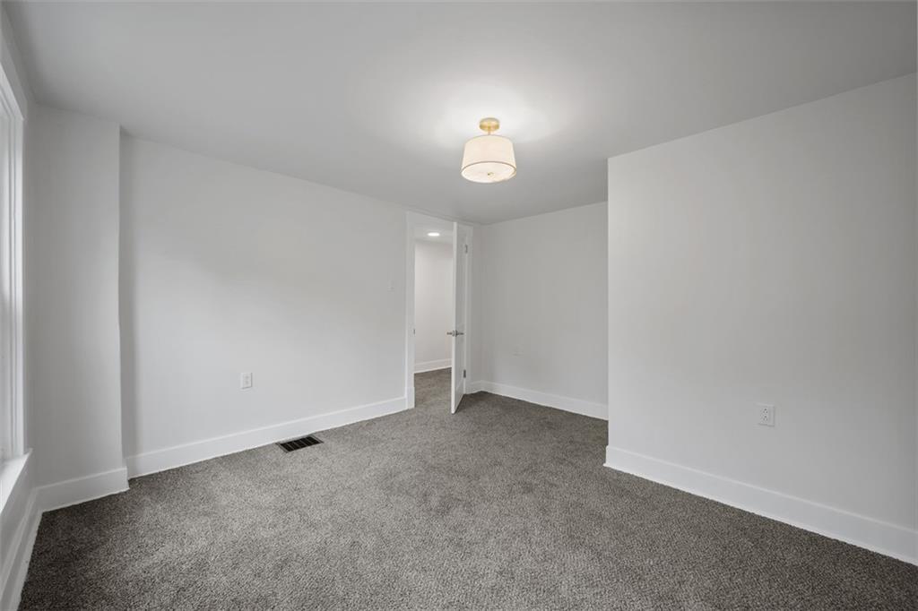 230 Linnview Avenue Pittsburgh, PA 15210 - Photo 19 of 32 a view of an empty room with a window