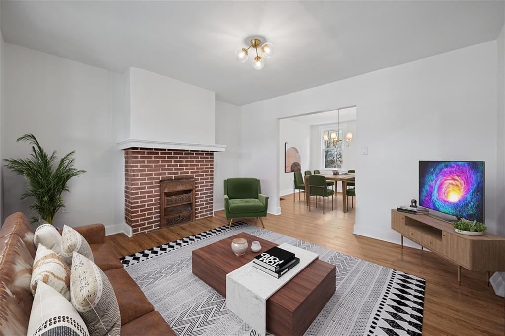 230 Linnview Avenue Pittsburgh, PA 15210 - Photo 2 of 32 a living room with furniture and a flat screen tv