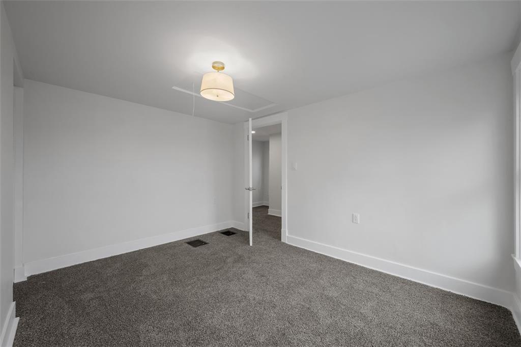 230 Linnview Avenue Pittsburgh, PA 15210 - Photo 24 of 32 an empty room with a fireplace