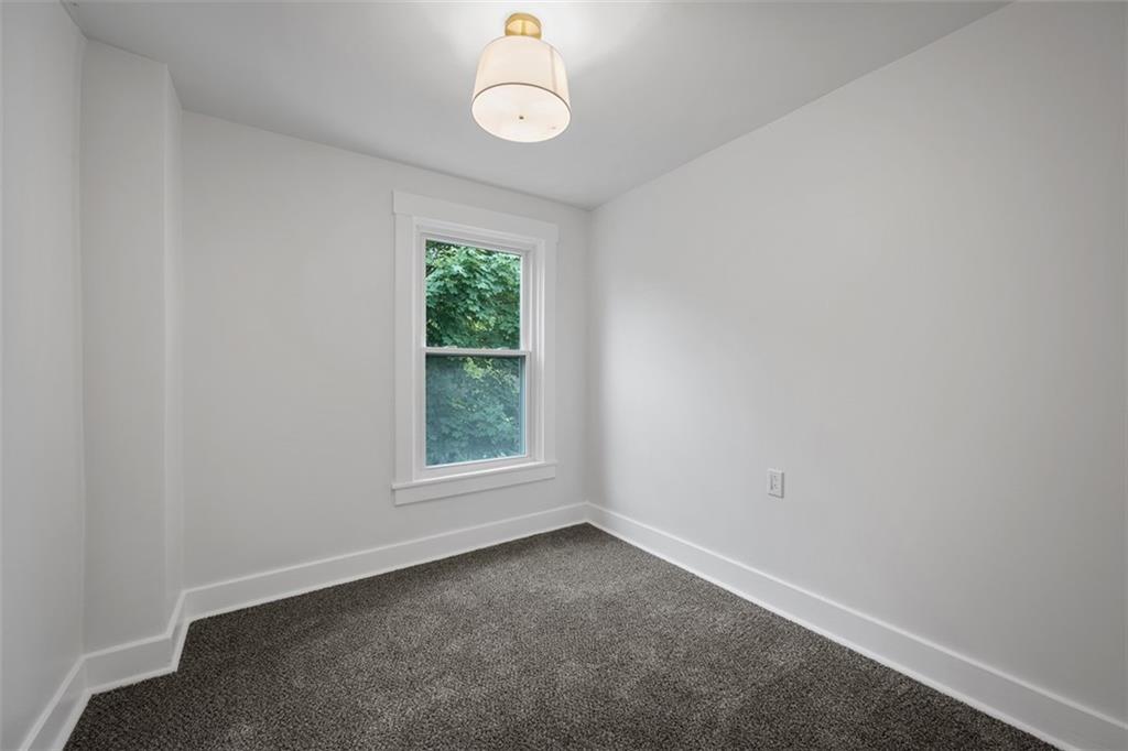 230 Linnview Avenue Pittsburgh, PA 15210 - Photo 25 of 32 an empty room with windows