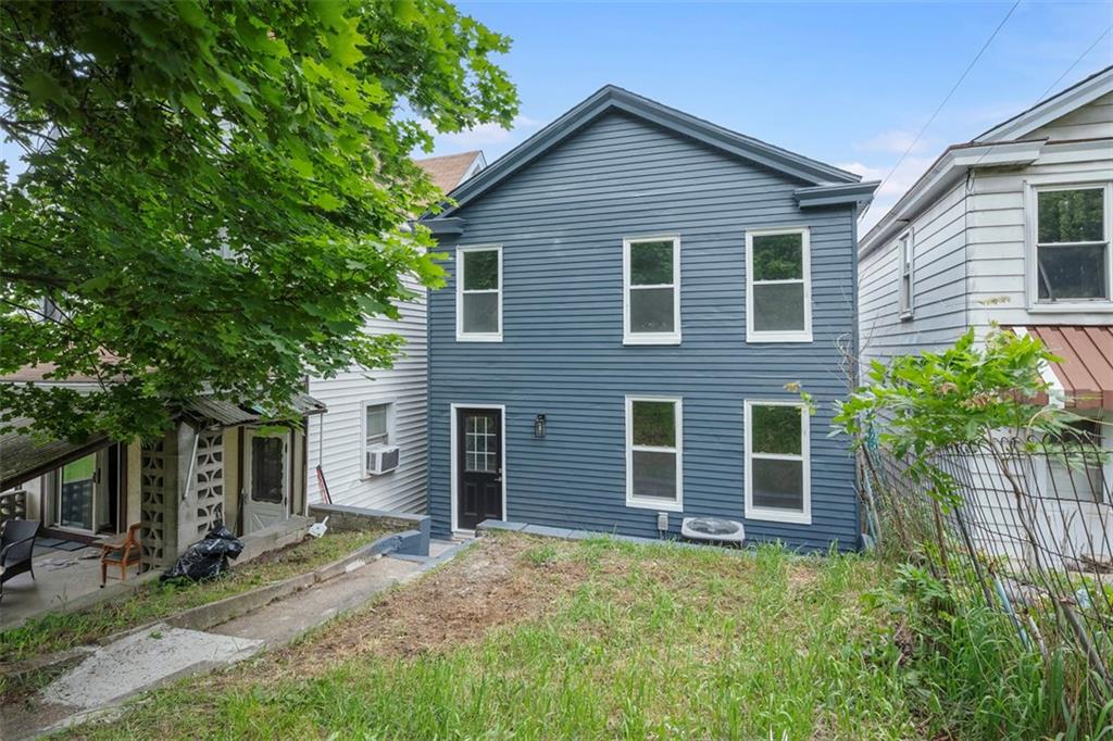 230 Linnview Avenue Pittsburgh, PA 15210 - Photo 28 of 32 a front view of a house with a yard and garage