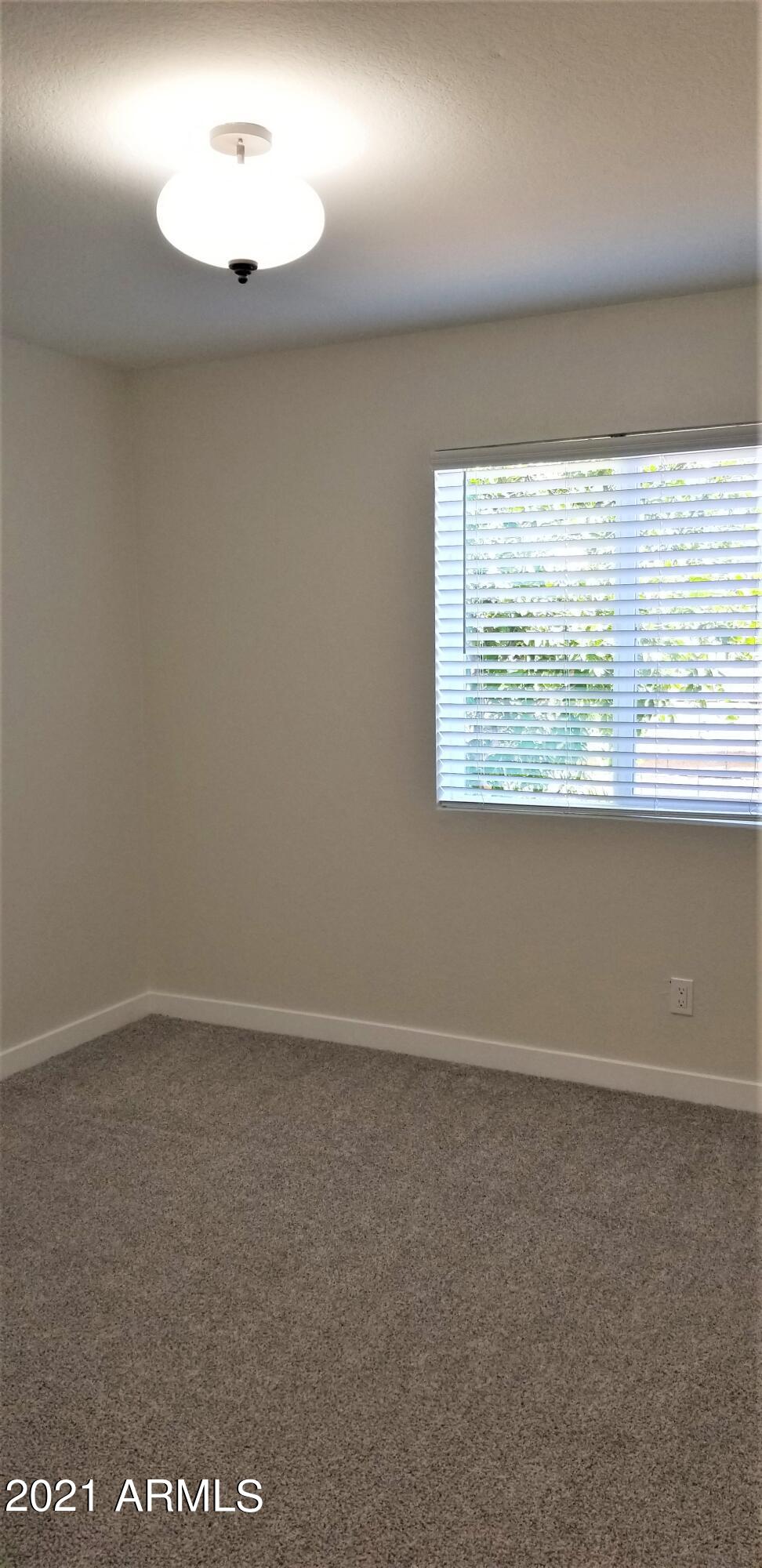 2738 East Decatur Street Mesa, AZ 85213 - Photo 33 of 52 Bedroom 3 with new carpet, paint, basebo