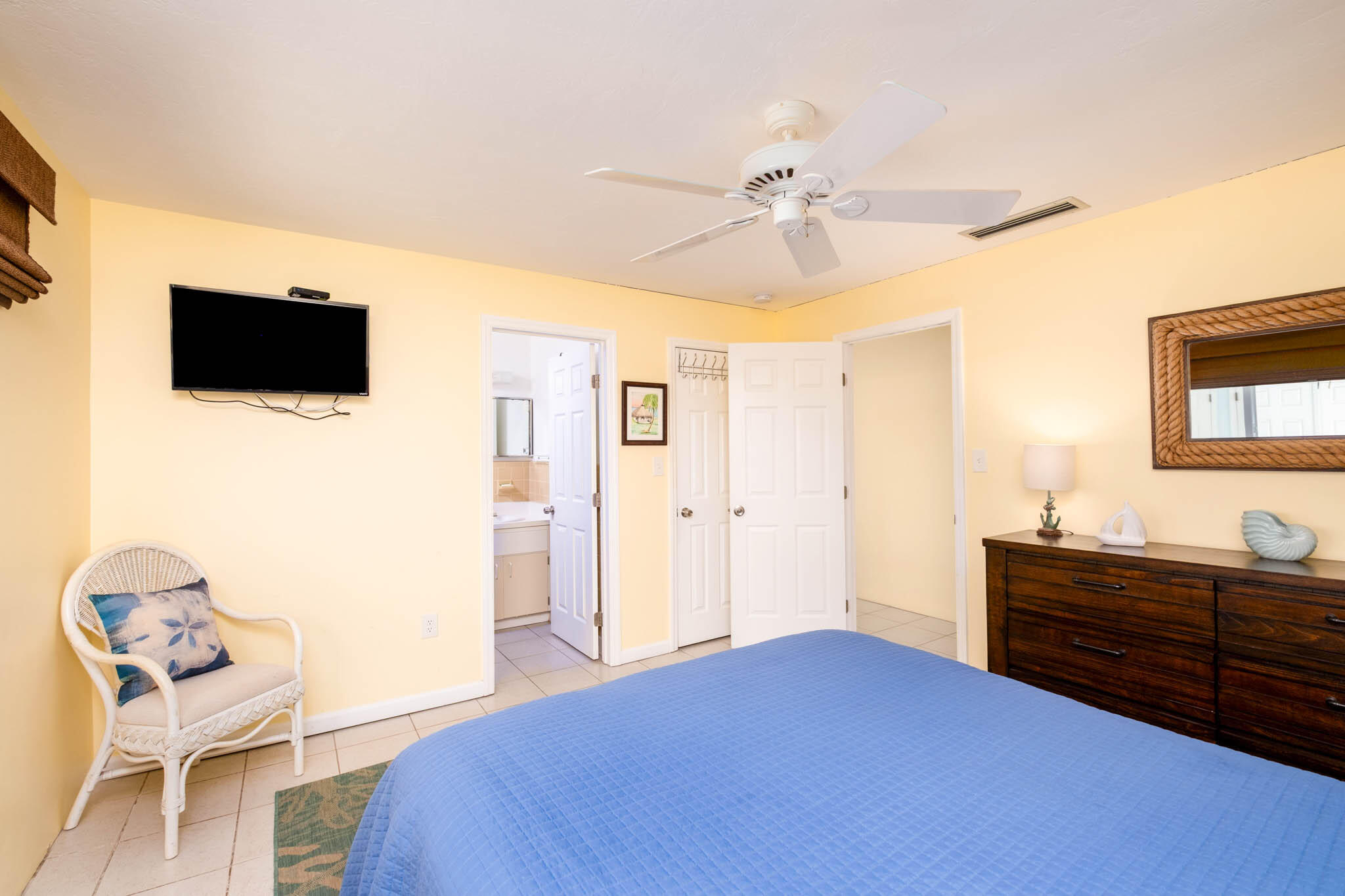 271 9th Street Key Colony Beach, FL 33051 - Photo 11 of 48 a bedroom with a bed and a flat screen tv