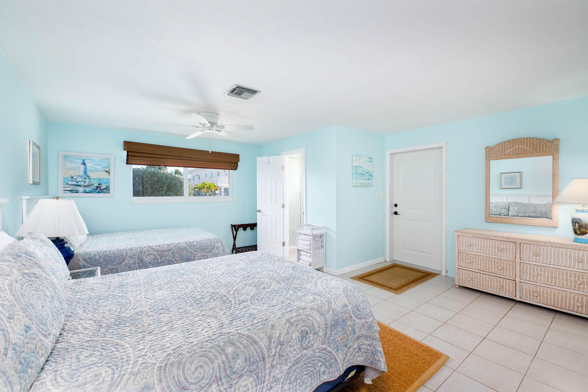 271 9th Street Key Colony Beach, FL 33051 - Photo 13 of 48 a bedroom with a large bed and a couch