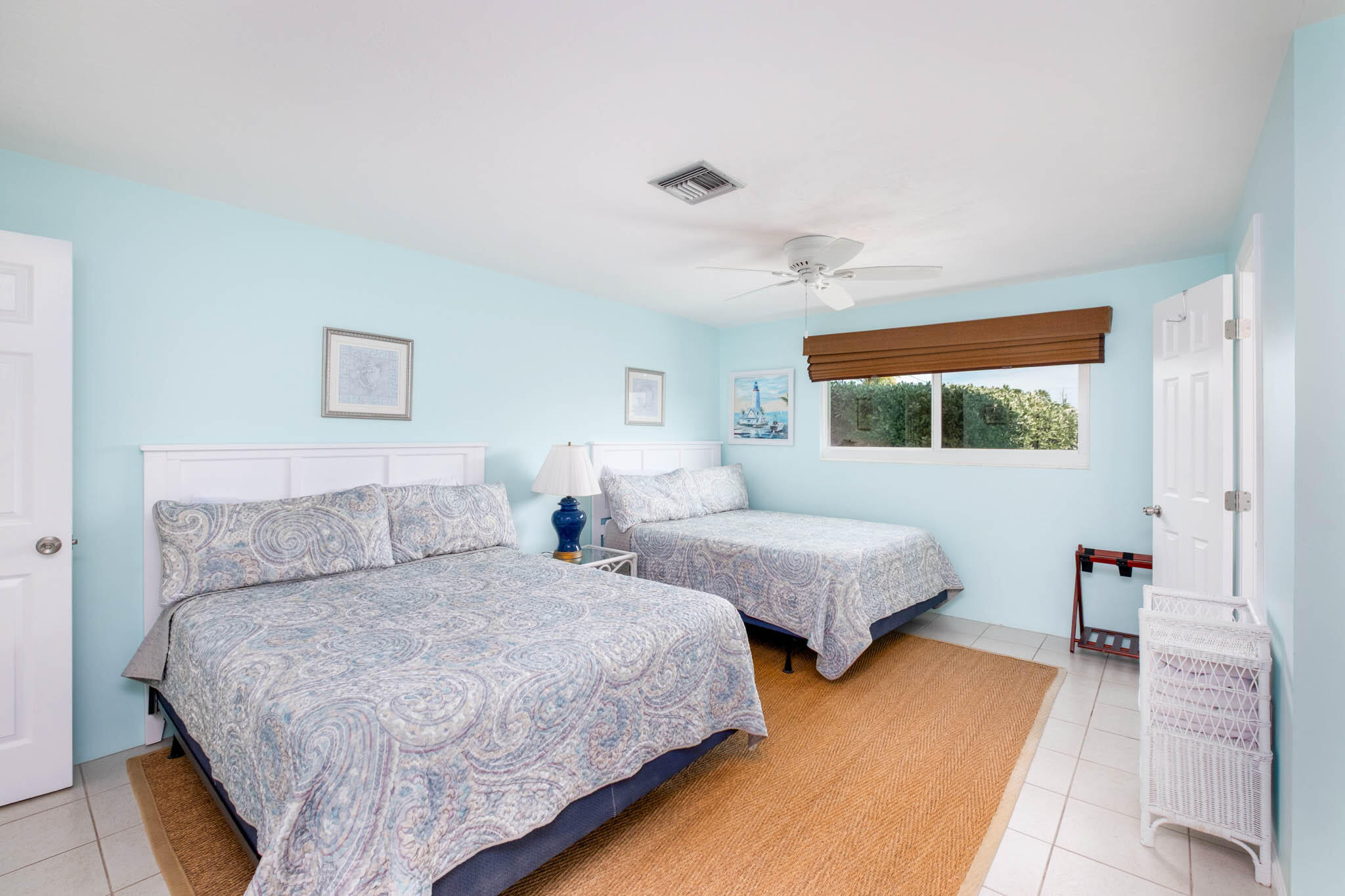 271 9th Street Key Colony Beach, FL 33051 - Photo 14 of 48 a bedroom with two beds and wooden floor