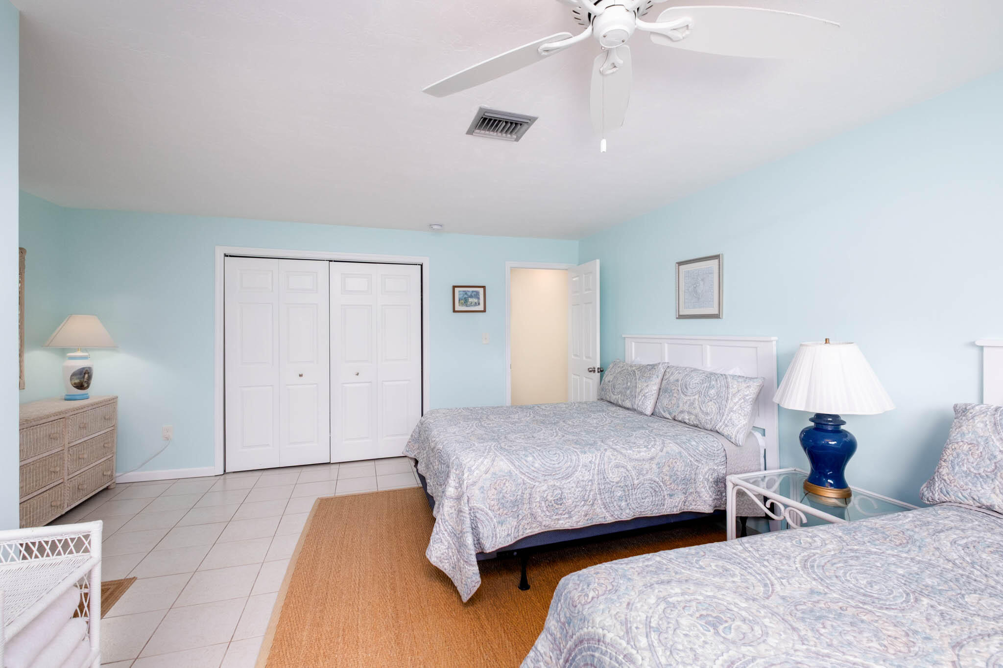 271 9th Street Key Colony Beach, FL 33051 - Photo 16 of 48 a bedroom with two beds and a chandelier