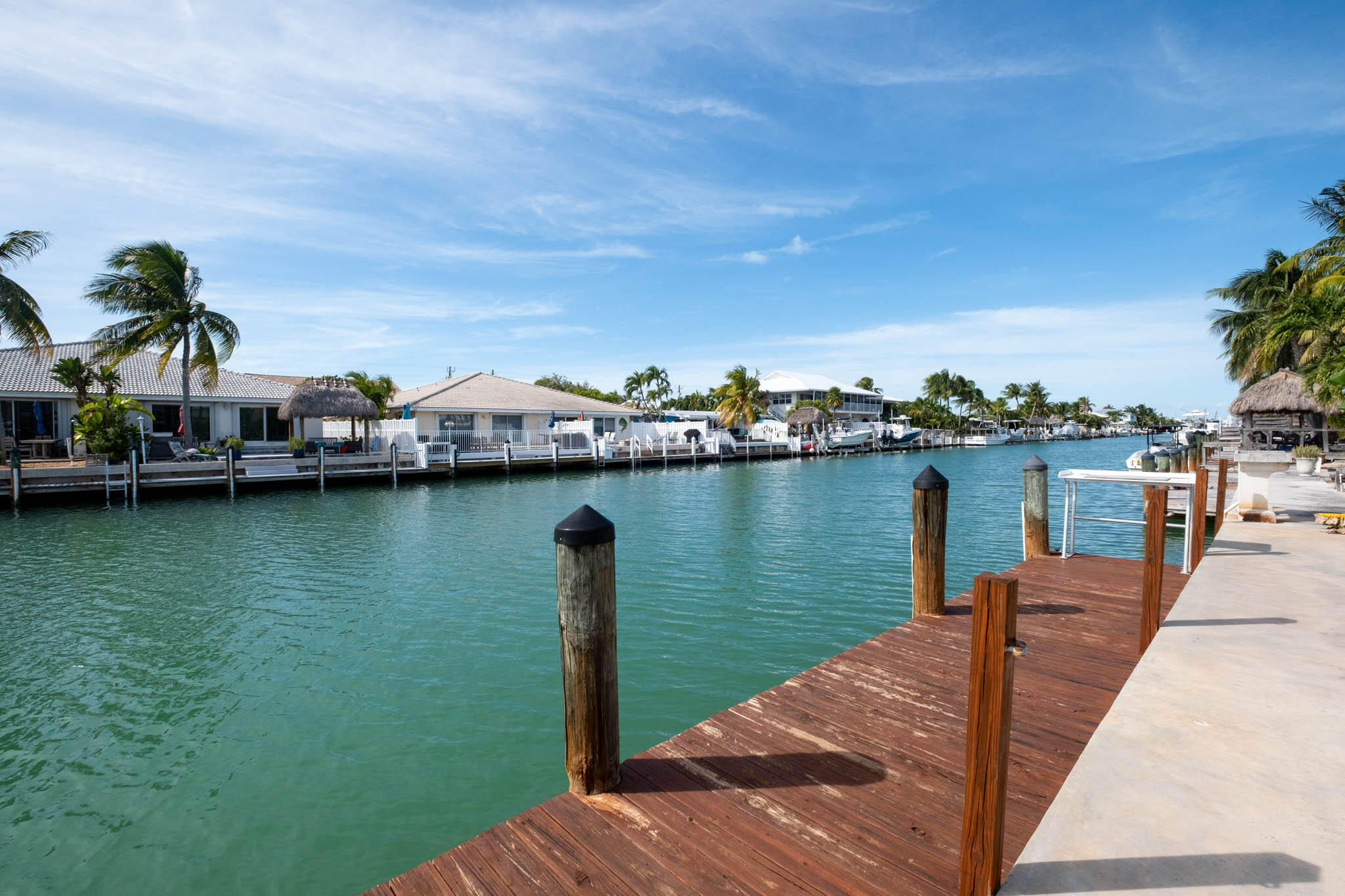271 9th Street Key Colony Beach, FL 33051 - Photo 17 of 48 a view of a lake with boats and trees in the background