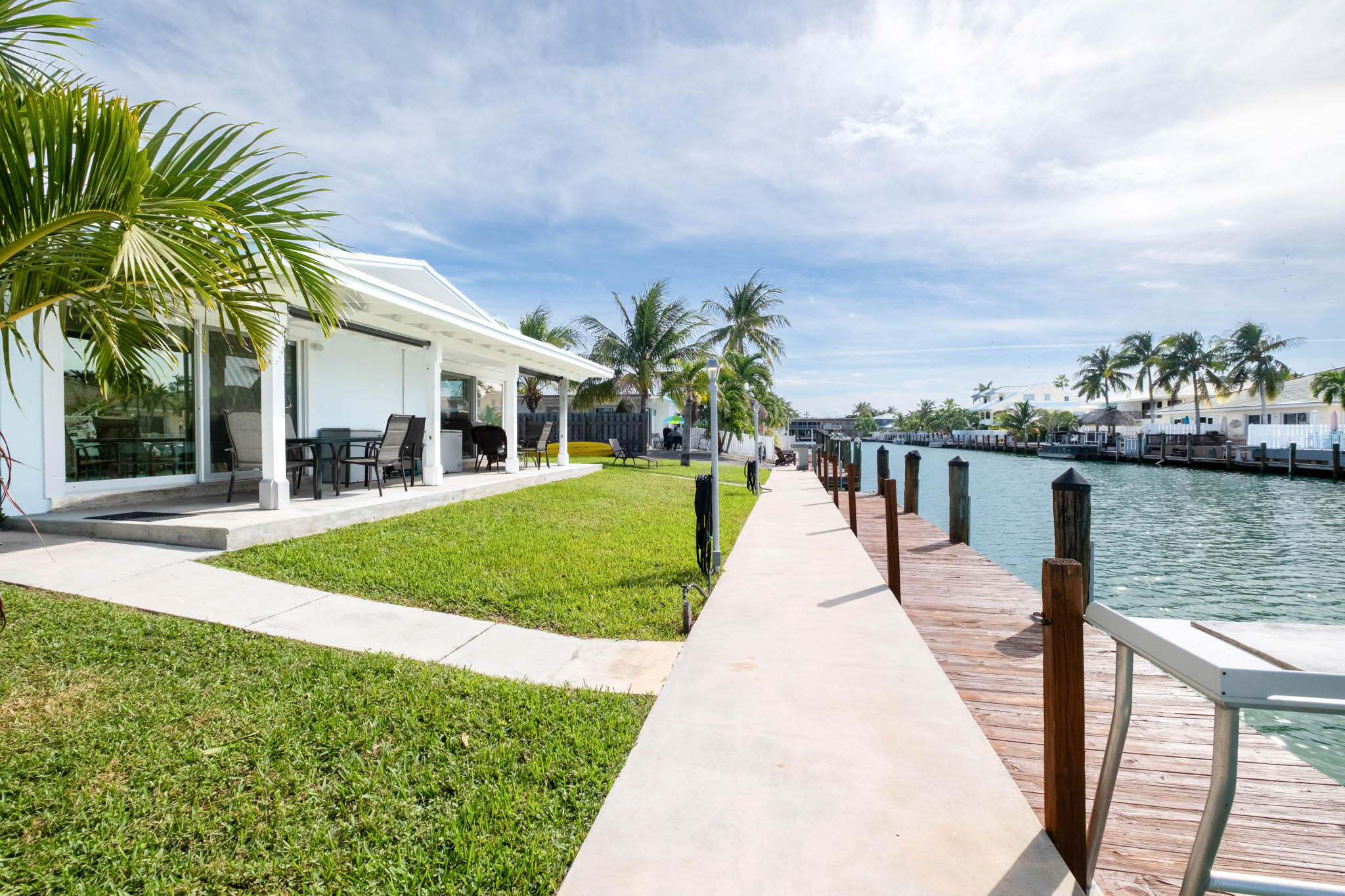 271 9th Street Key Colony Beach, FL 33051 - Photo 19 of 48 a view of a house with a yard and potted plants
