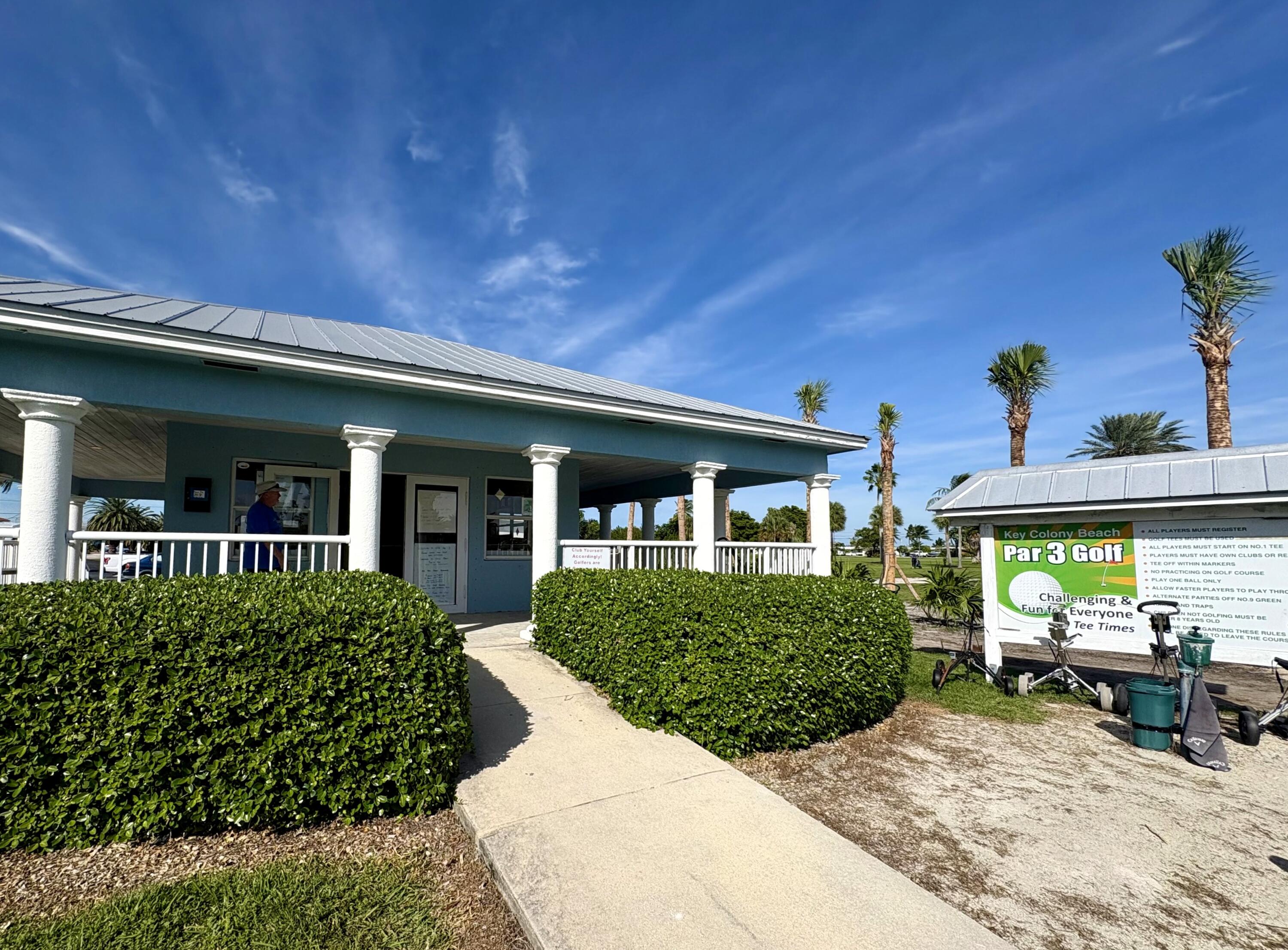 271 9th Street Key Colony Beach, FL 33051 - Photo 35 of 48 a view of a house with potted plants and a bench