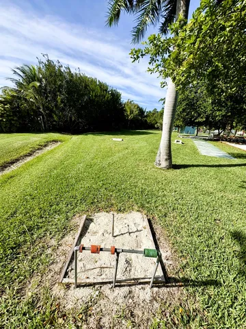 a view of a swimming pool with a yard