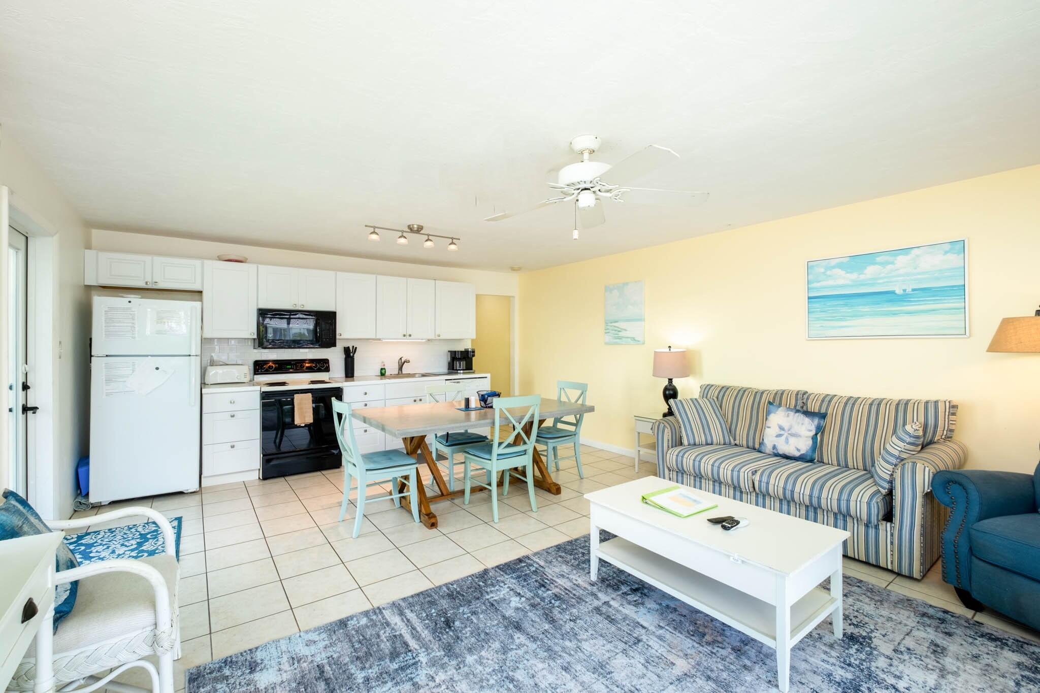 271 9th Street Key Colony Beach, FL 33051 - Photo 9 of 48 a living room with furniture and kitchen view