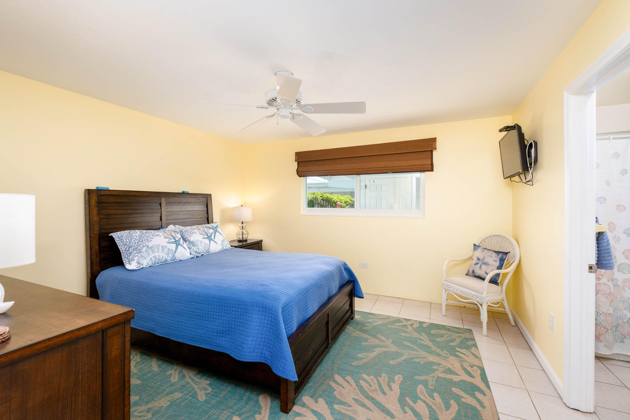 271 9th Street Key Colony Beach, FL 33051 - Photo 10 of 48 a bedroom with a bed and a table in it