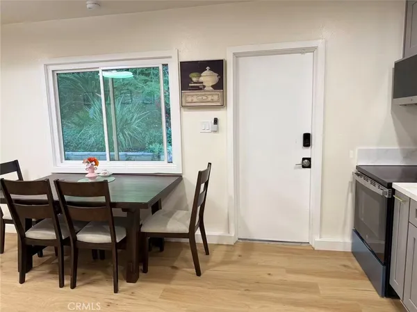 a kitchen with stainless steel appliances a refrigerator and a stove top oven