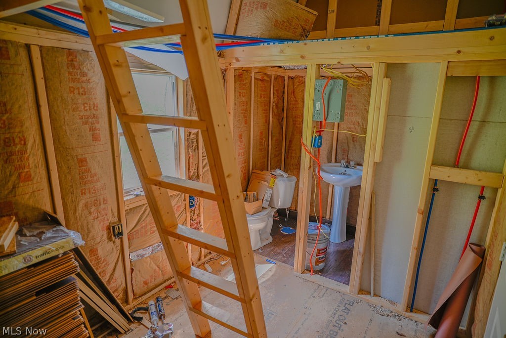 1547 Providence Road Elizabeth, WV 26143 - Photo 17 of 32 Framed interior space featuring exposed wood studs, visible insulation, and a partial window