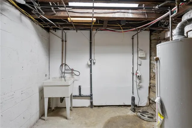 a utility room with a table and chairs