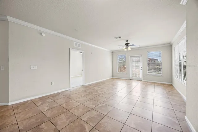 a view of an empty room with a window