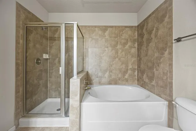 a bathroom with a tub and a shower