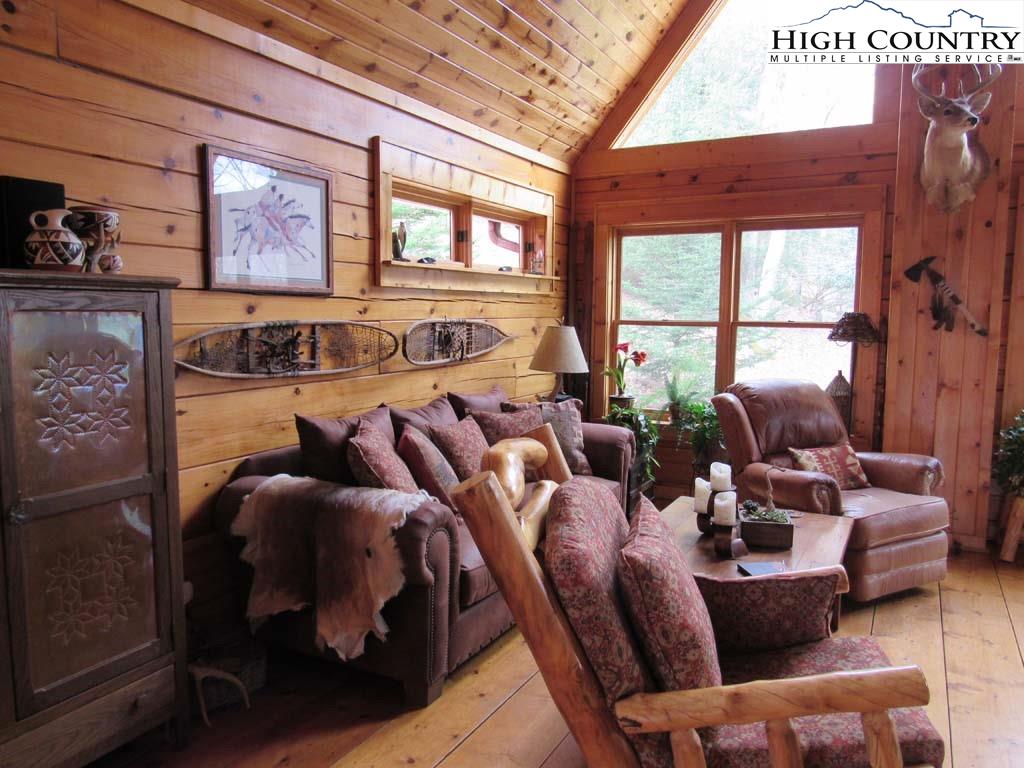 1487 Bryan Davis Road Creston, NC 28615 - Photo 15 of 50 a living room with furniture and windows