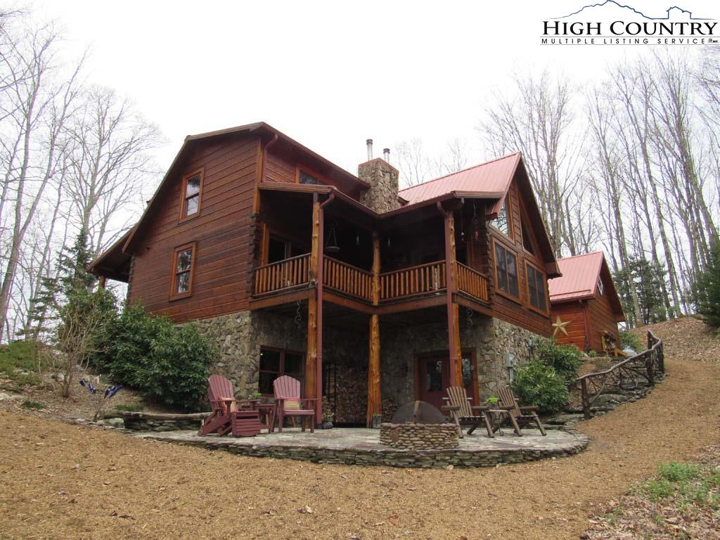 1487 Bryan Davis Road Creston, NC 28615 - Photo 31 of 50 a view of a house with a yard and sitting area