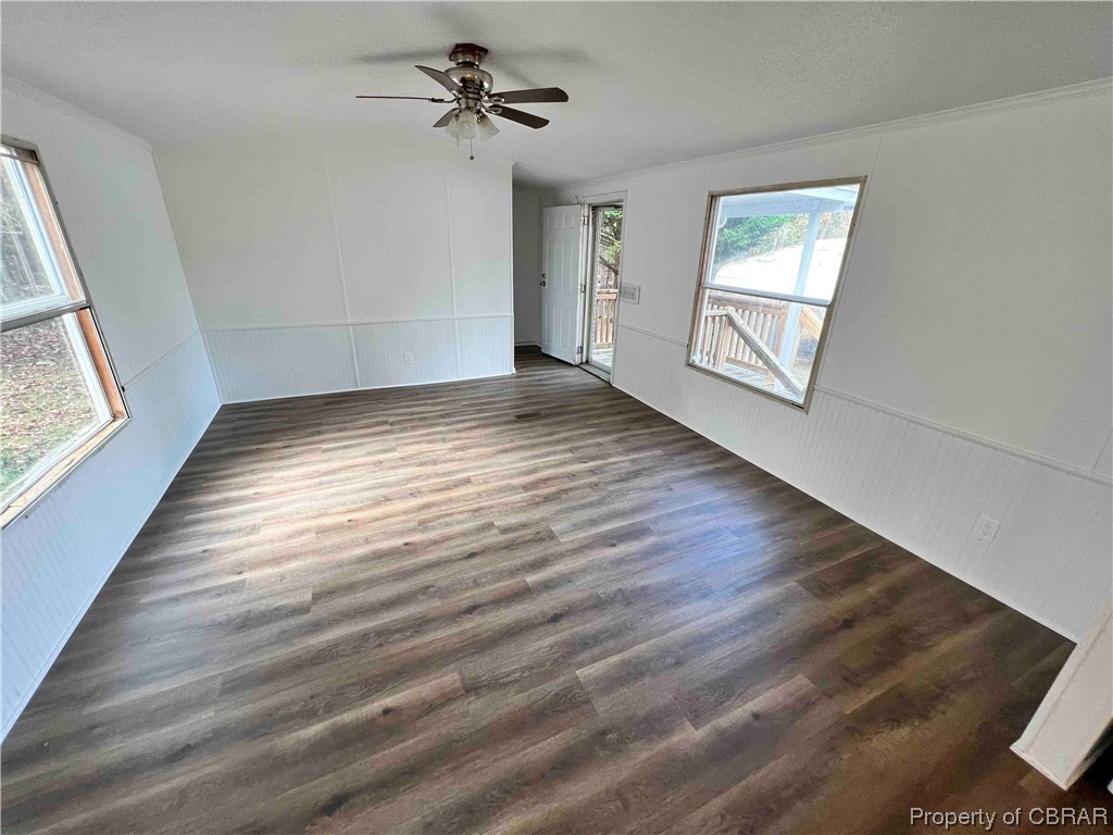 1295 Kates Neck Road Locust Hill, VA 23092 - Photo 17 of 24 Spare room featuring lofted ceiling, ceiling fan, and dark hardwood / wood-style flooring