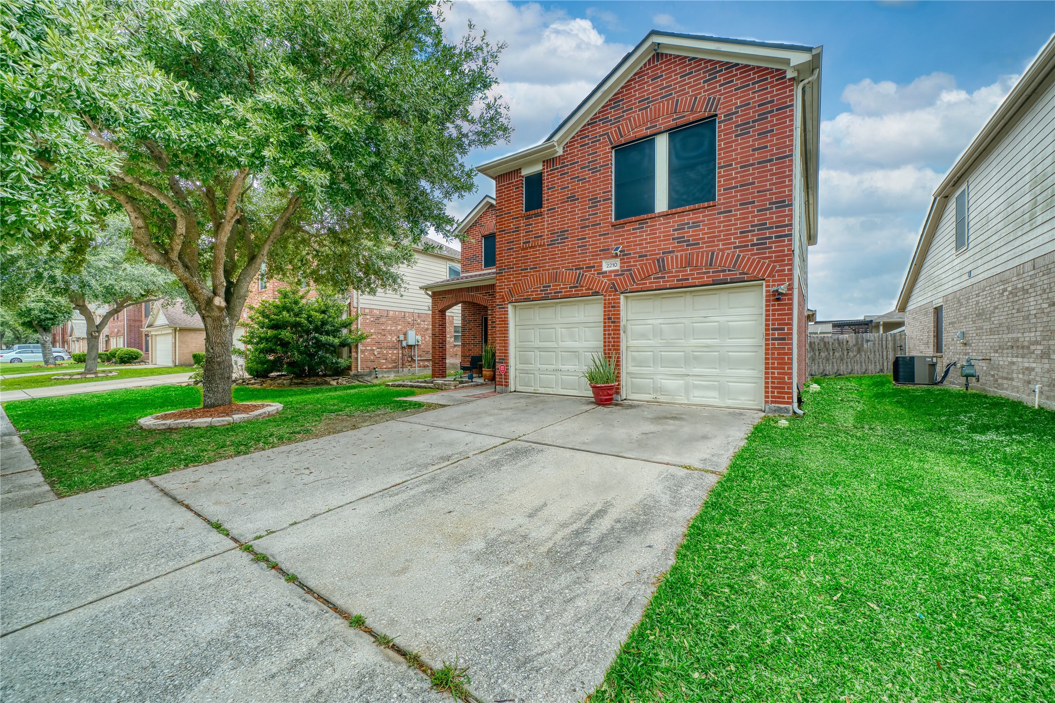 2210 Mountain Ranch Drive Houston, TX 77049 - Photo 5 of 36 a front view of a house with a yard