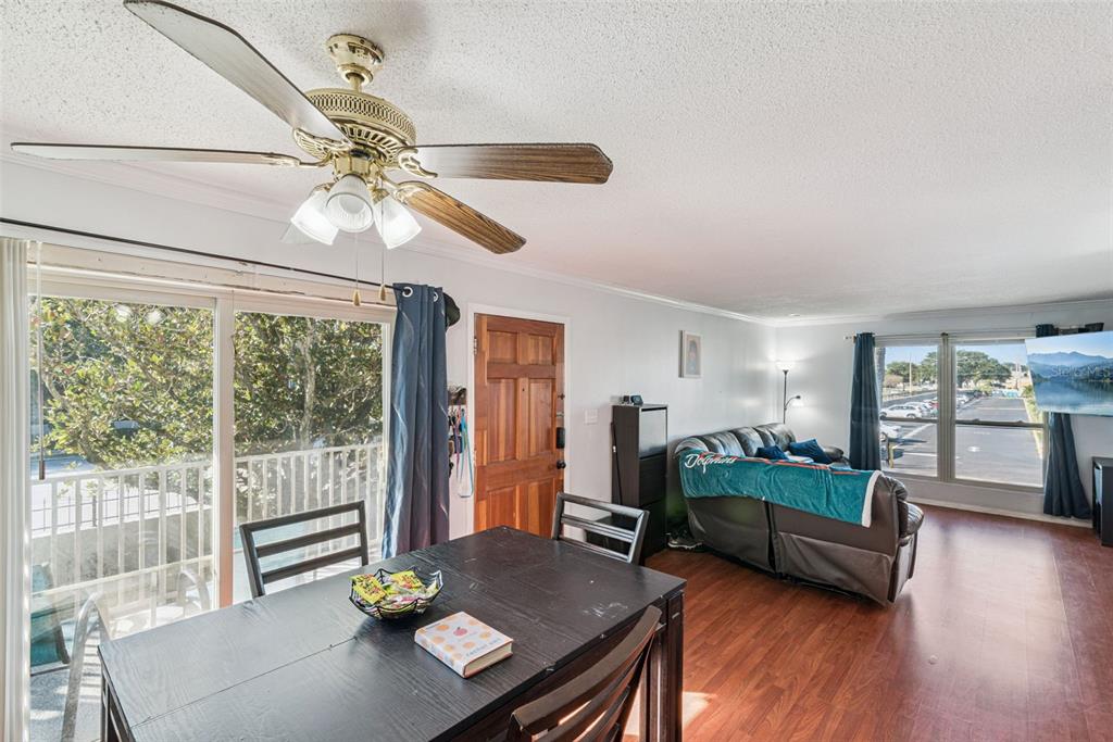 1935 South Conway Road, Unit 6 Orlando, FL 32812 - Photo 11 of 25 a living room with furniture and a large window