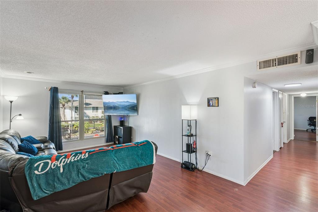 1935 South Conway Road, Unit 6 Orlando, FL 32812 - Photo 12 of 25 a living room with furniture and a window