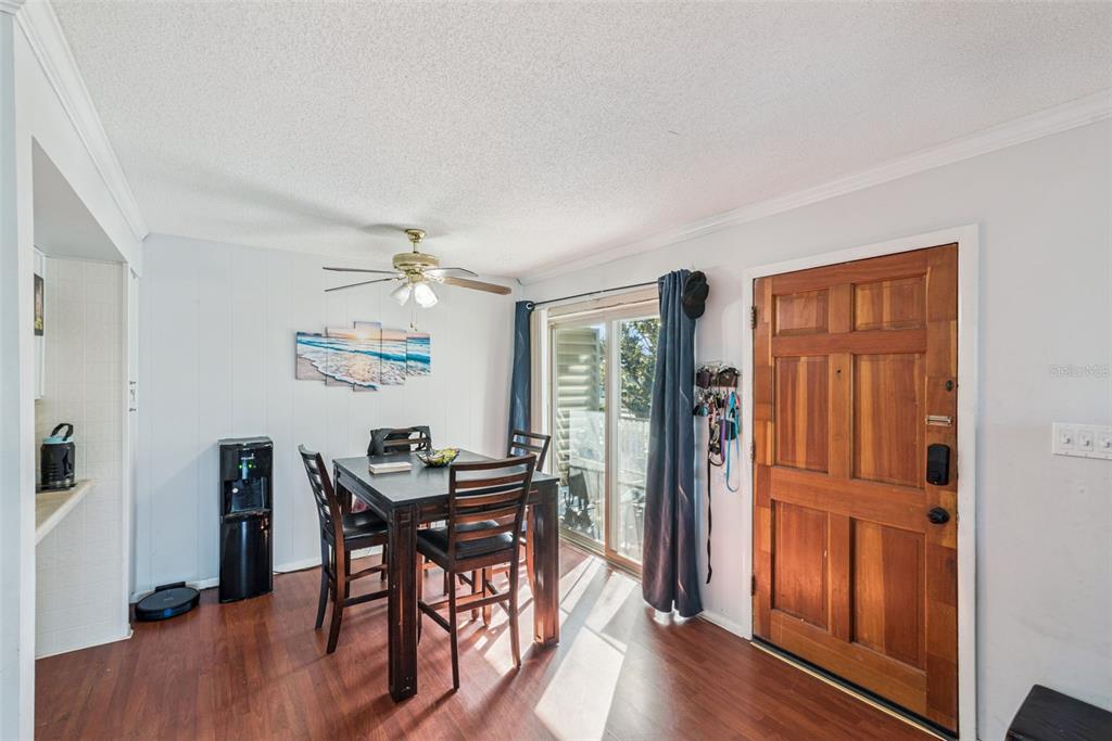 1935 South Conway Road, Unit 6 Orlando, FL 32812 - Photo 2 of 25 a view of a livingroom with furniture and wooden floor
